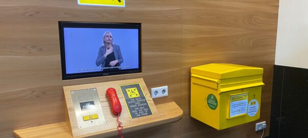 A sign language video displayed on a television.