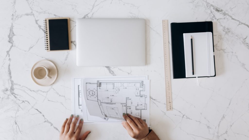 Architect reviewing documents on table