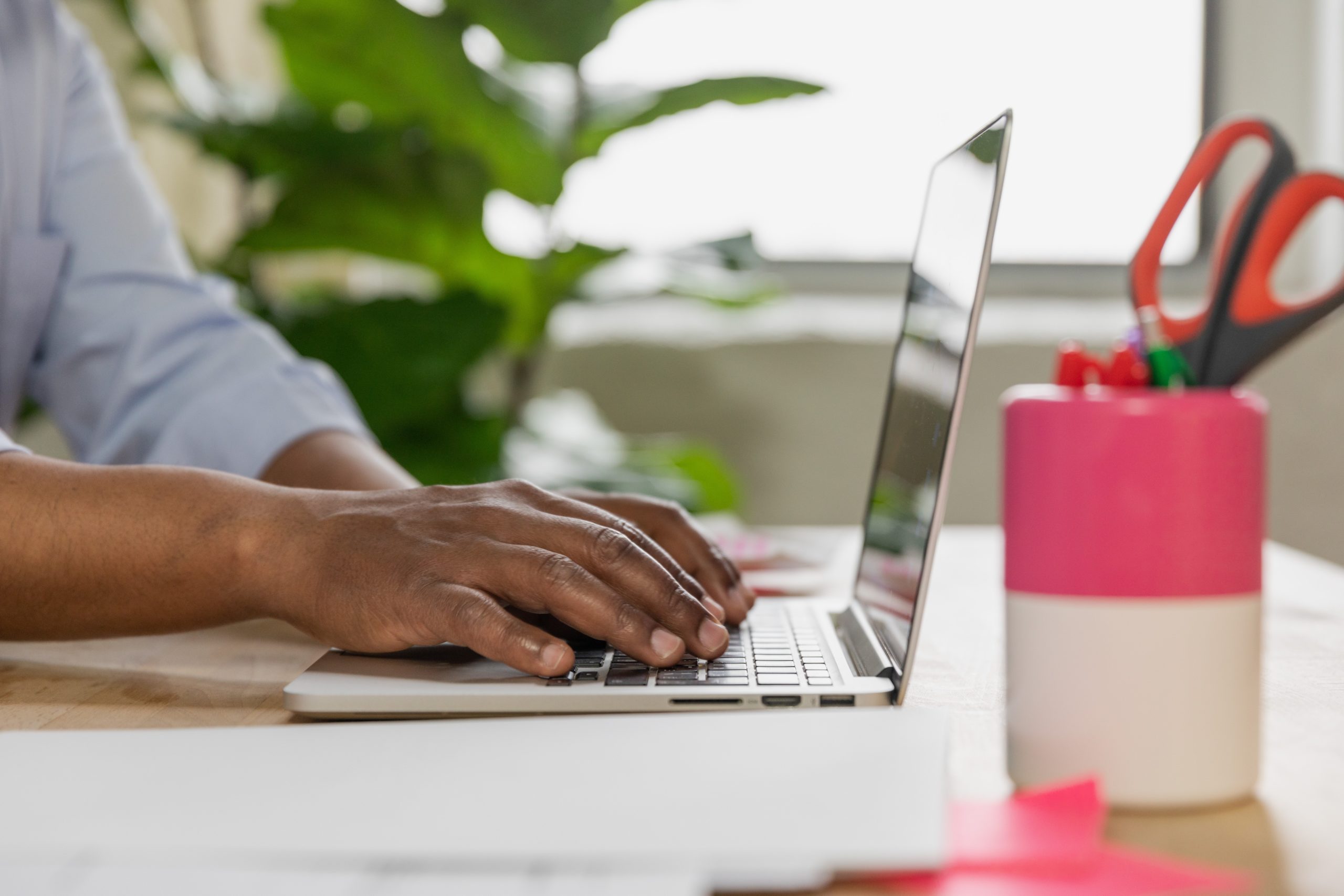 Man typing on a computer