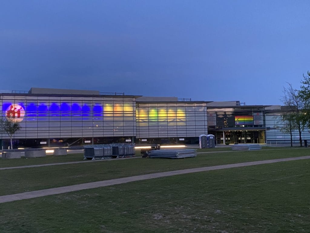 National Waterfront museum exterior in the evening with greenery and a path leading to the entrance in the foreground
