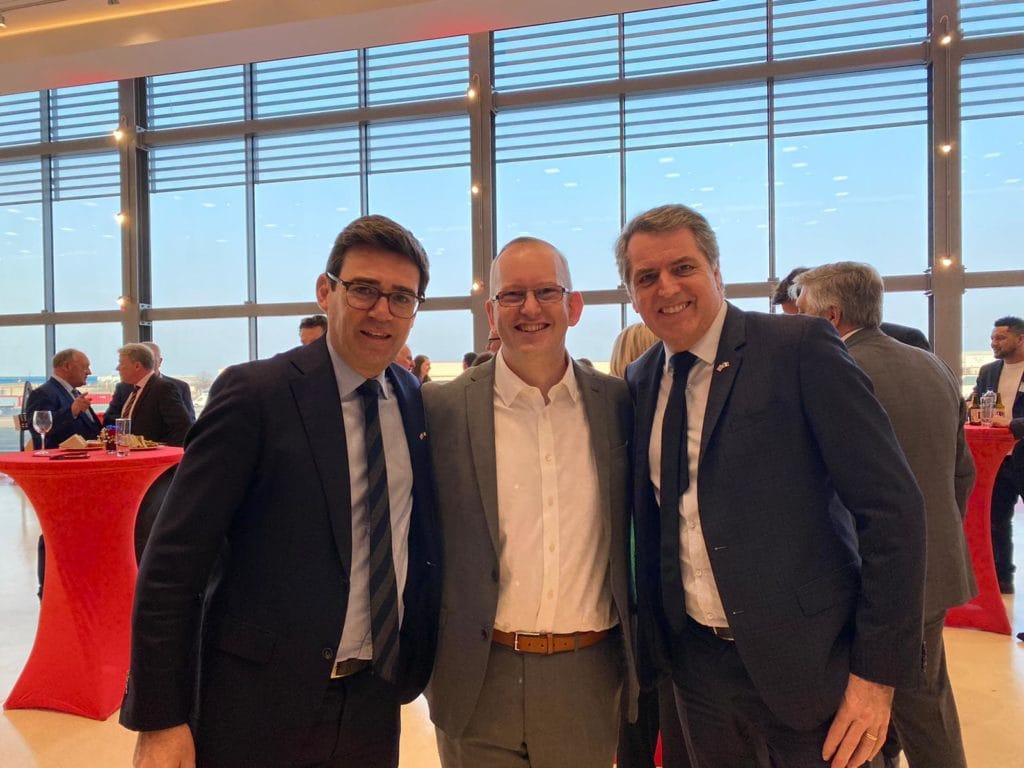 Direct Access operations director Steve Dering, Manchester Mayor And Burnham and Liverpool Mayor Steve Rotheram pose for a group photograph.