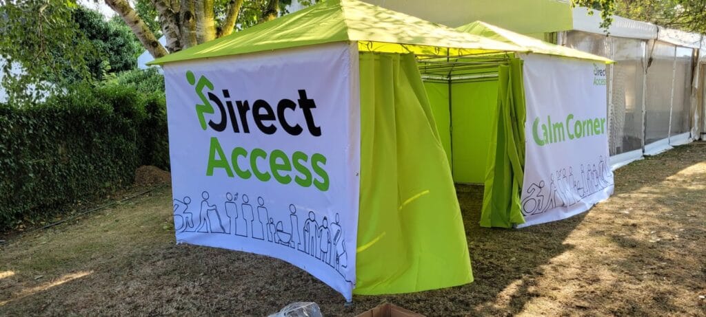Green and white marquee dressed with a 'Direct Access' logo banner