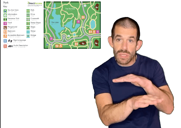 Man signing in BSL explains a park map