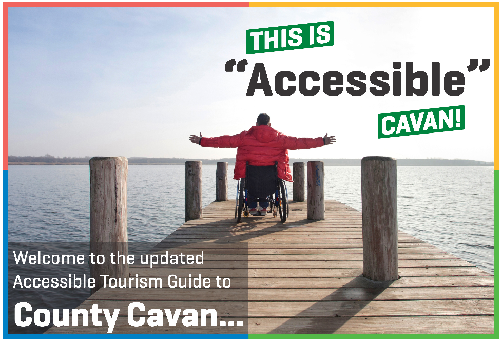 A man in a wheelchair spreads his arms on the edge of a pier next to a lake. In the sky, bold text reads "This is Accessible Cavan.