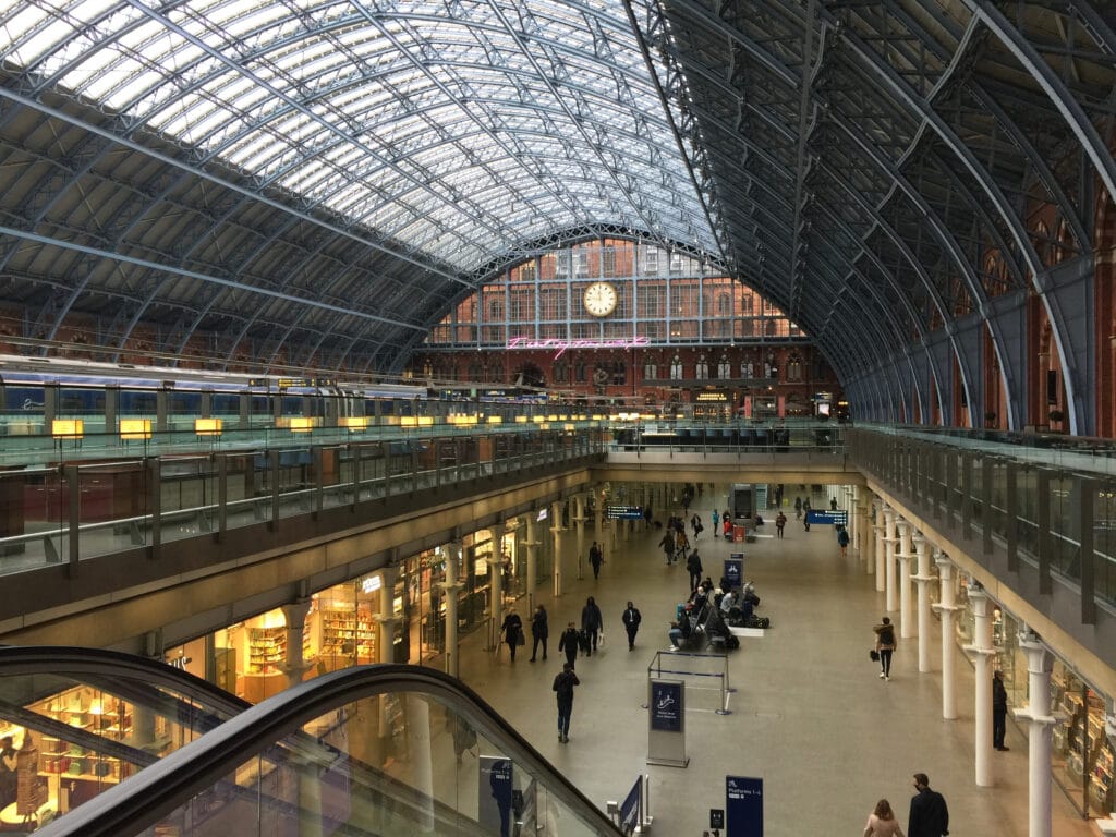 Interior of St Pancras International - a central London railway terminus on Euston Road in the London Borough of Camden. The Eurostar train platform can be seen on the left.