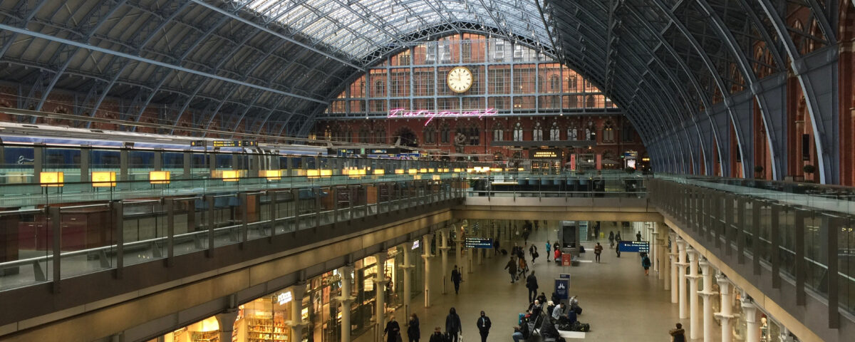 Interior of St Pancras International - a central London railway terminus on Euston Road in the London Borough of Camden. The Eurostar train platform can be seen on the left.