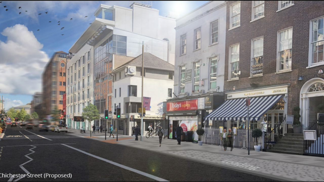 A proof of concept photograph of the proposed new design of Chichester Street in Belfast showing a bustling street front with new modern buildings.