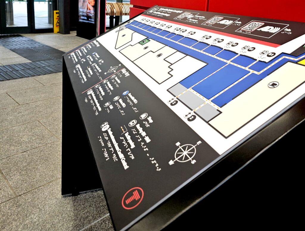 A Direct Access tactile map board at the entrance of the Cardiff Bus Interchange.