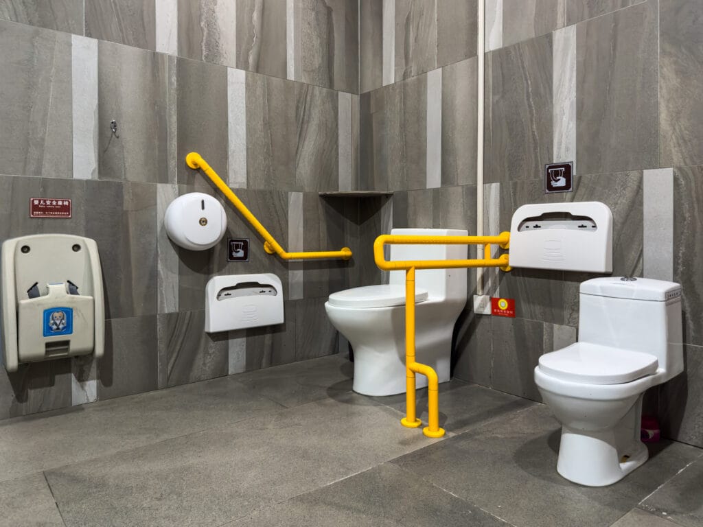 A Modern Accessible Bathroom Design with Safety Features including contrasted handrails.