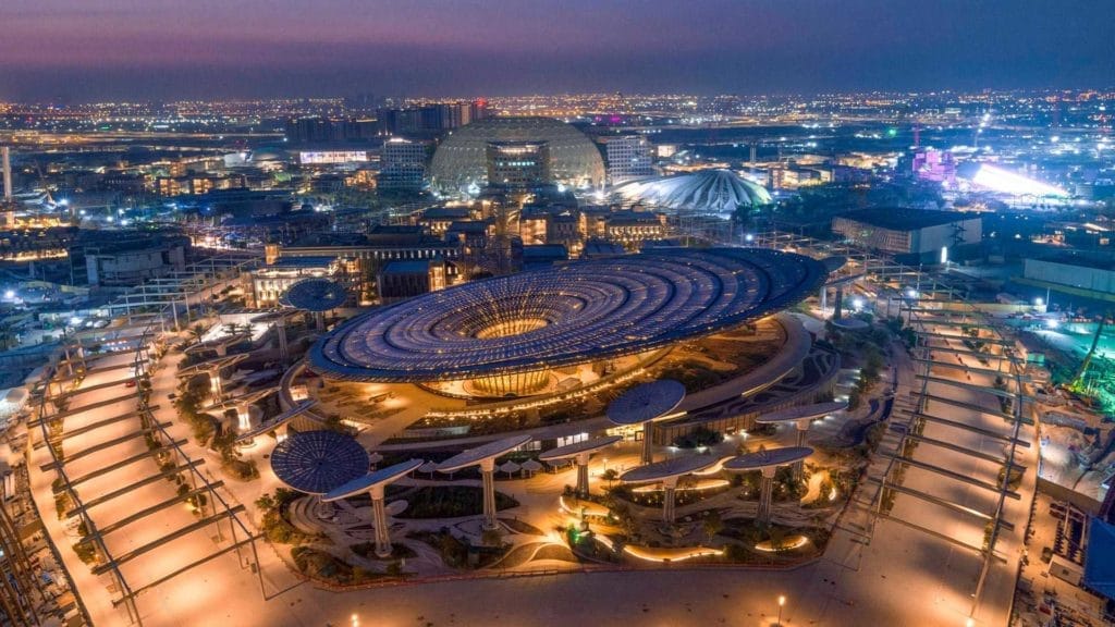 A panoramic view of Expo 2020 Dubai at night time.