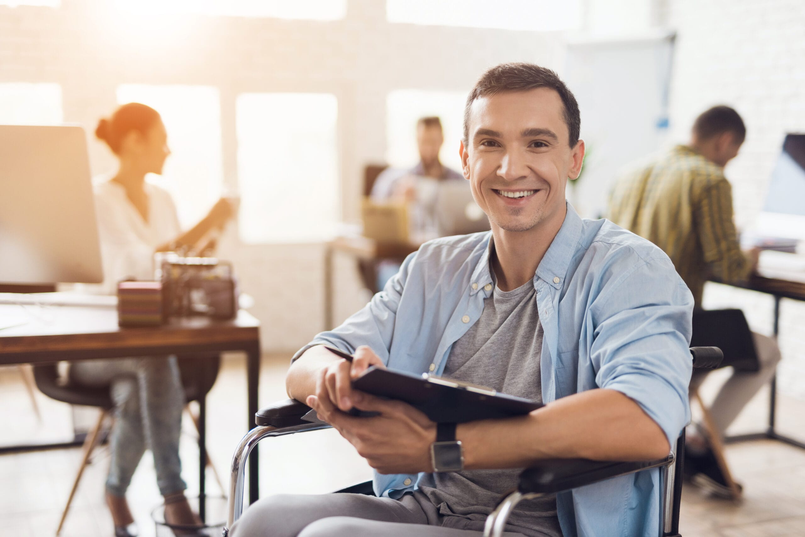 Disabled,Person,In,The,Wheelchair,Works,In,The,Office.,He