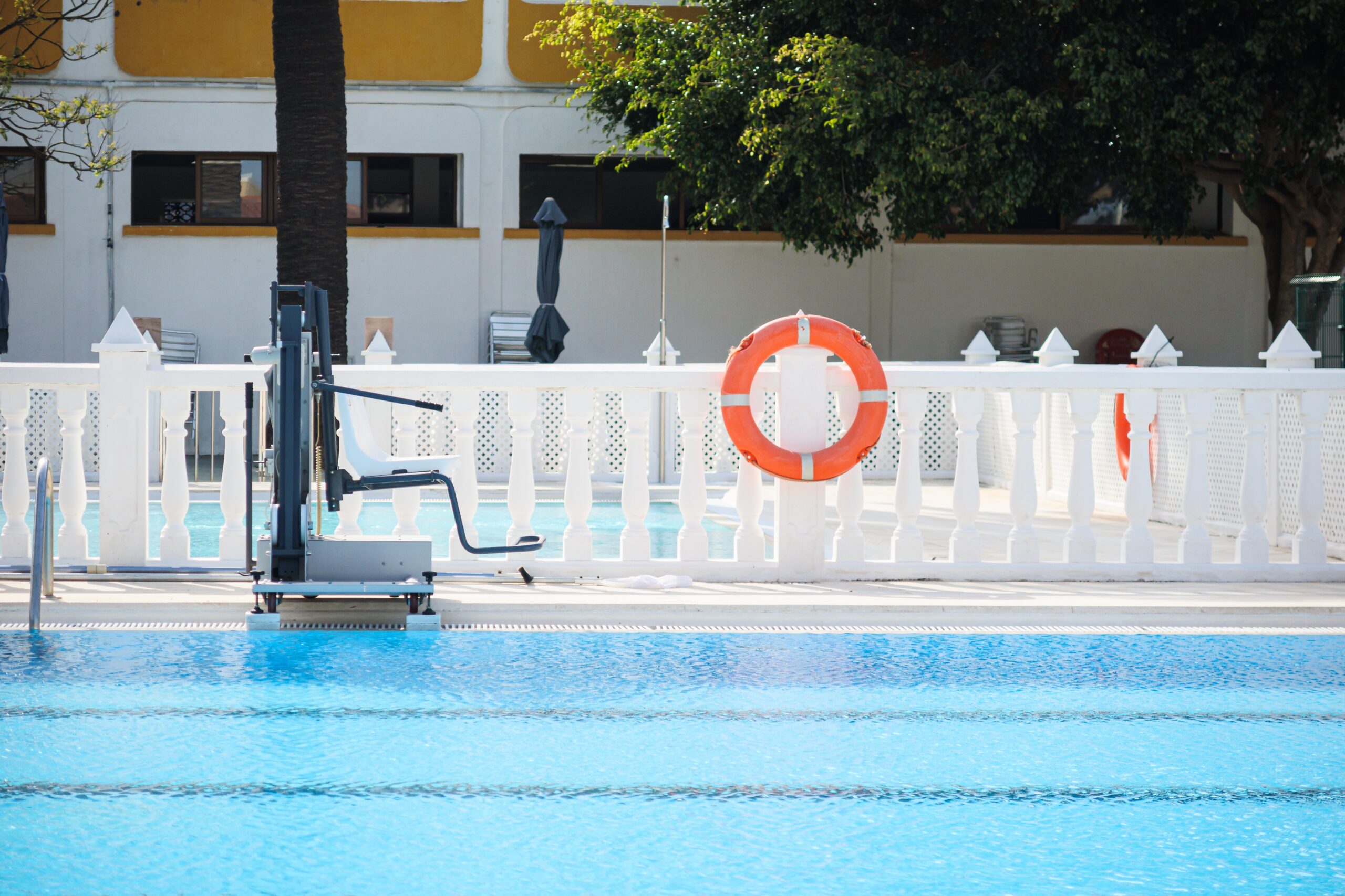 A,Pool,With,A,Lifeguard,Chair,And,A,Red,And