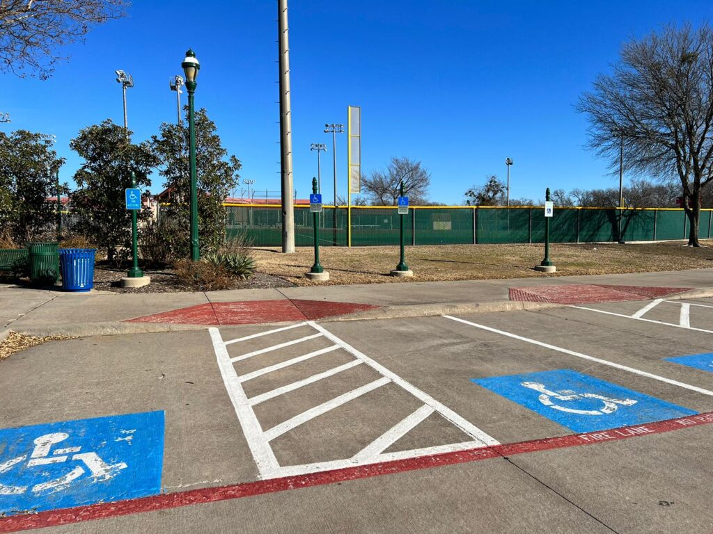 Three accessible parking spaces outside an Allen Texas park.