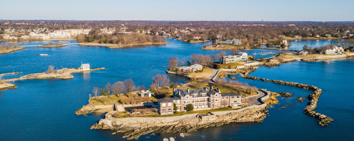 A panoramic aerial view of of Mamaroneck, New Rochelle, and Larchmont during the day.